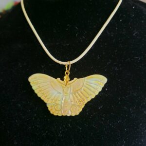 Carved butterfly pendant