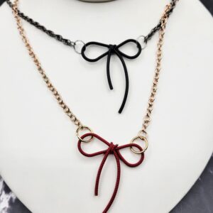 Metal bow on a chain