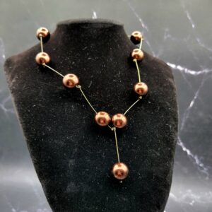 Copper glass pearls in geometric design